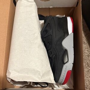 Jordan 4 RM Black and Varsity Red Sneakers